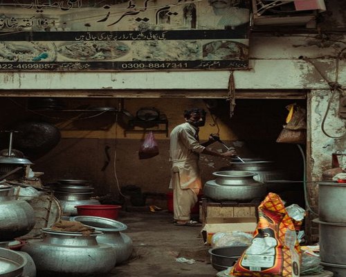 Kitchen scene in an urban Pakistani home with fresh ingredients